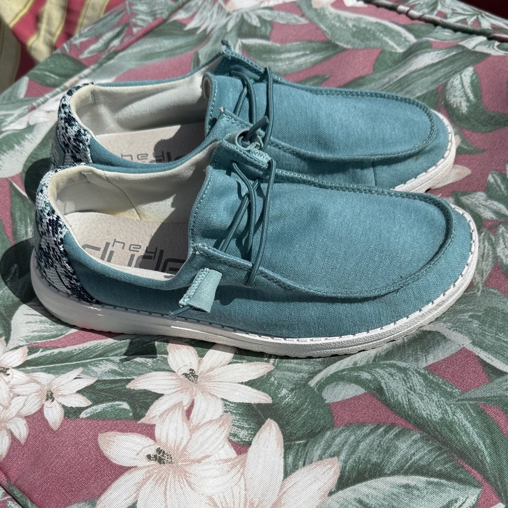 Hey Dude Teal Loafers with Patterned heel fabric.